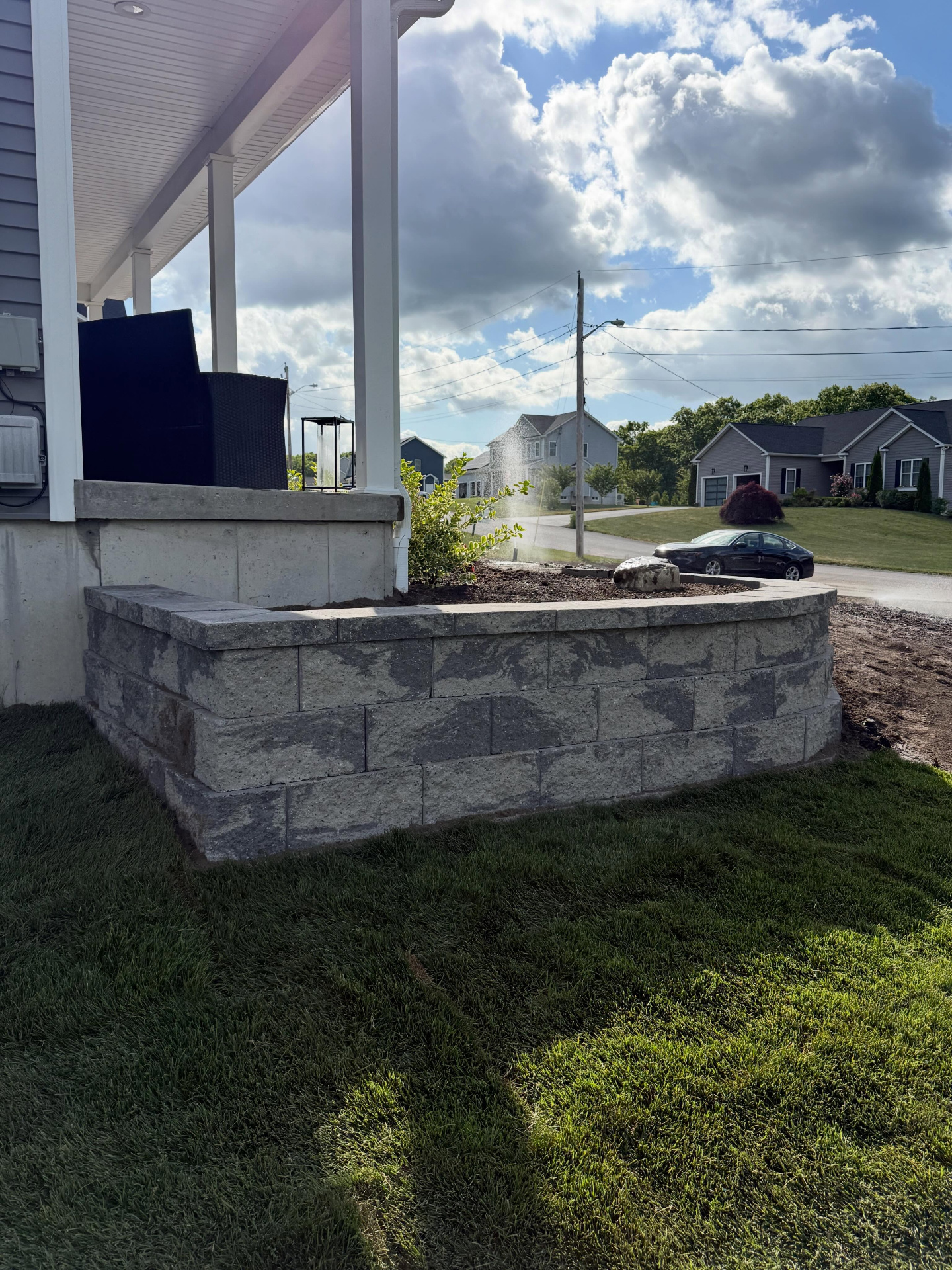 Tiered retaining wall with landscape lighting